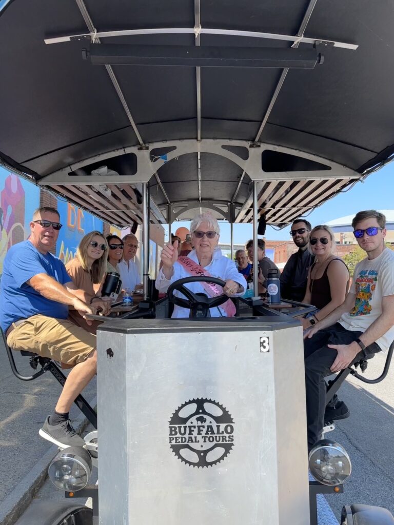family celebrating grandama's 80th birthday on a Buffalo Pedal Tour